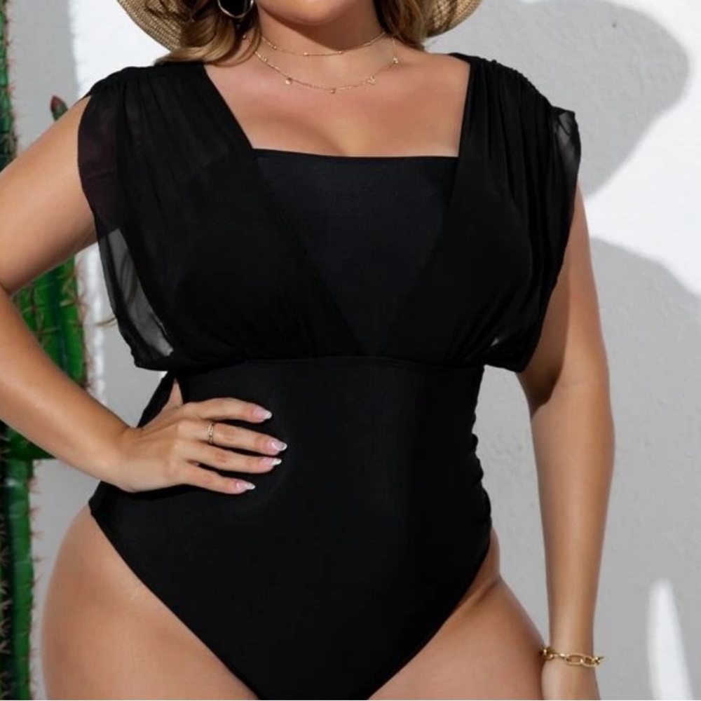 New with tags black one piece swimsuit.